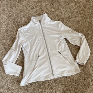 Tail white zippered long sleeve jacket with back ruffle.